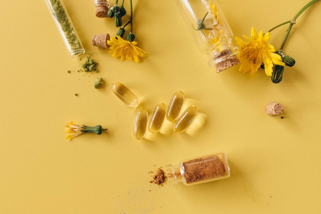 supplements on yellow background with flowers