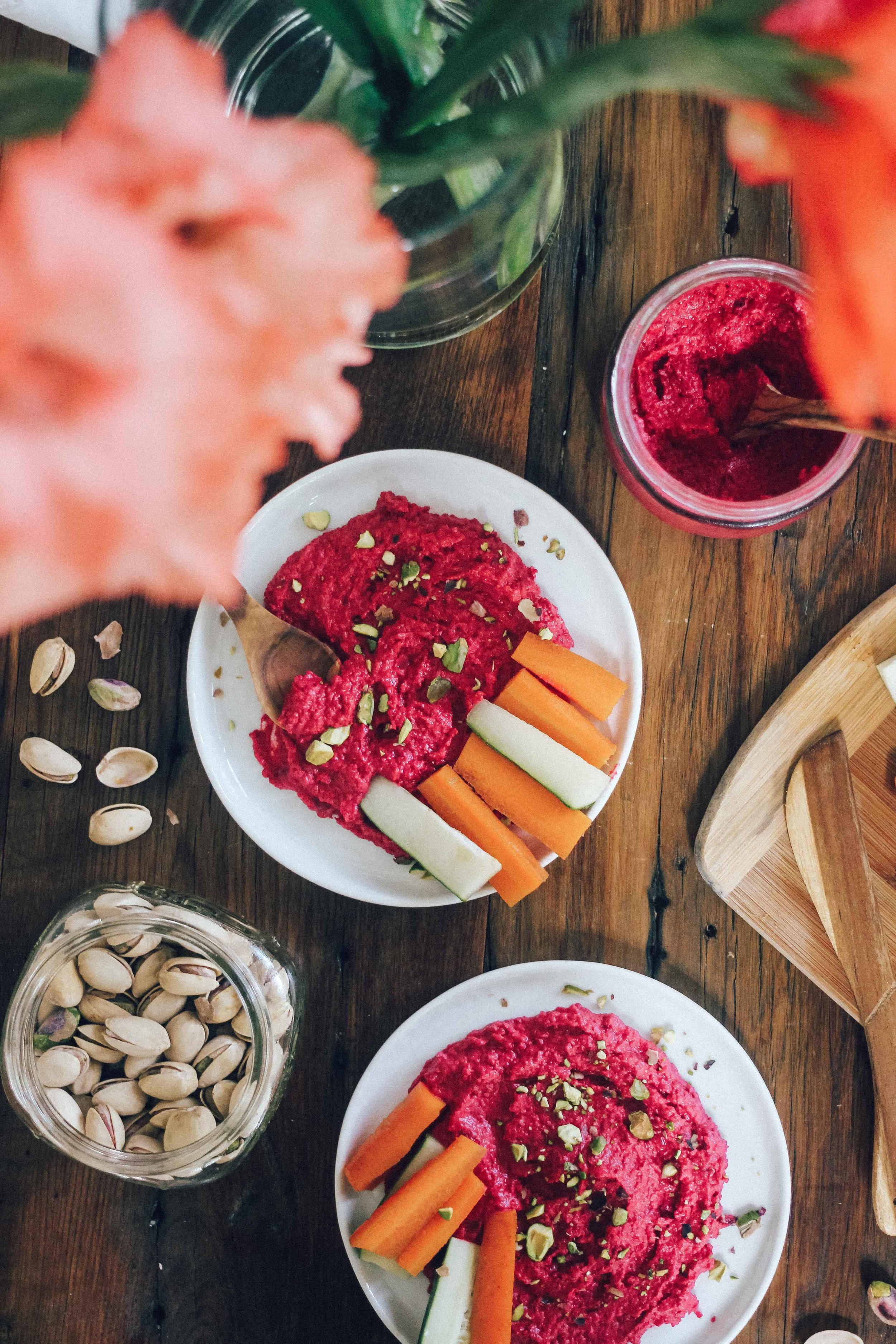 roasted beet hummus with carrots on a table