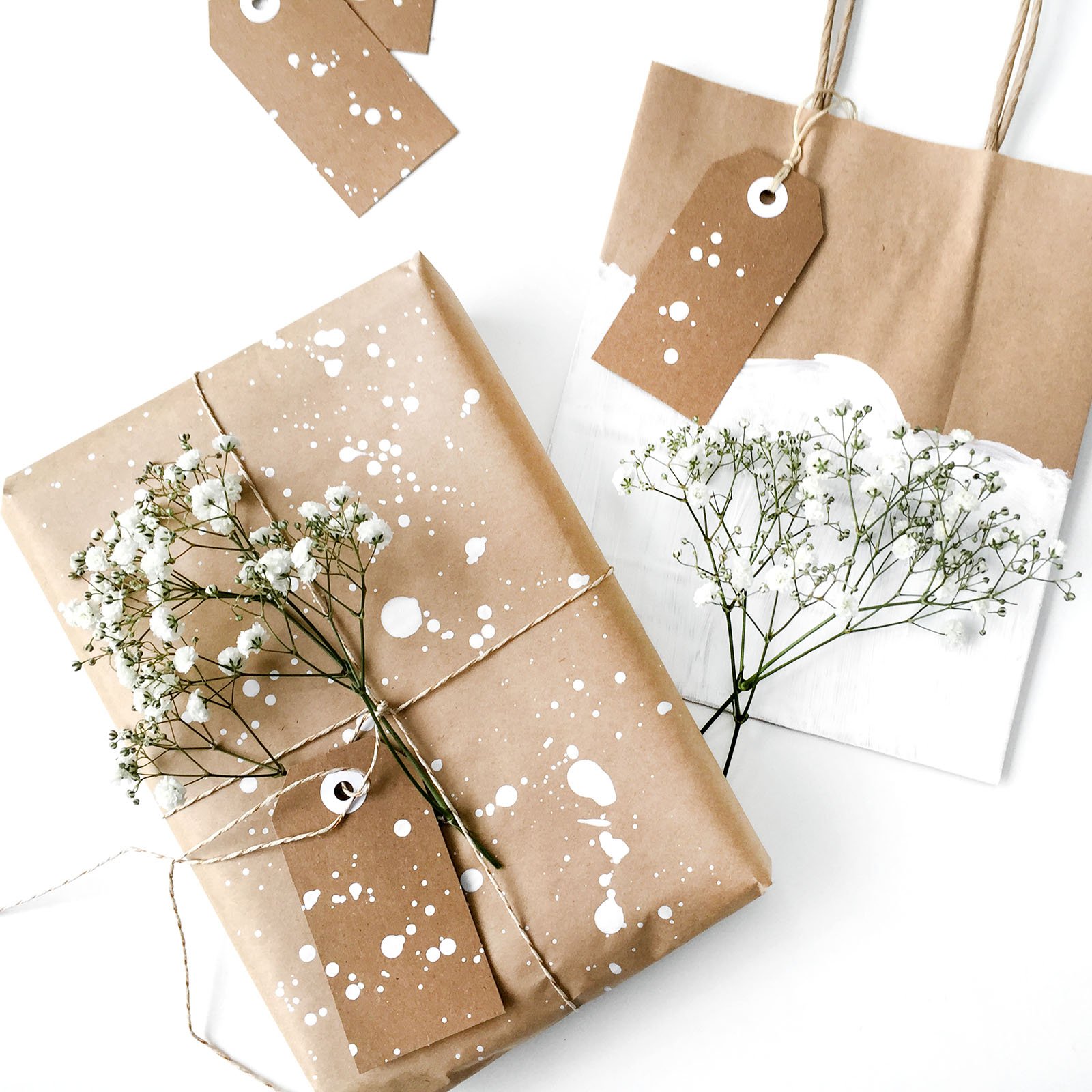 reusable wrapping paper made from brown craft paper and splattered white paint