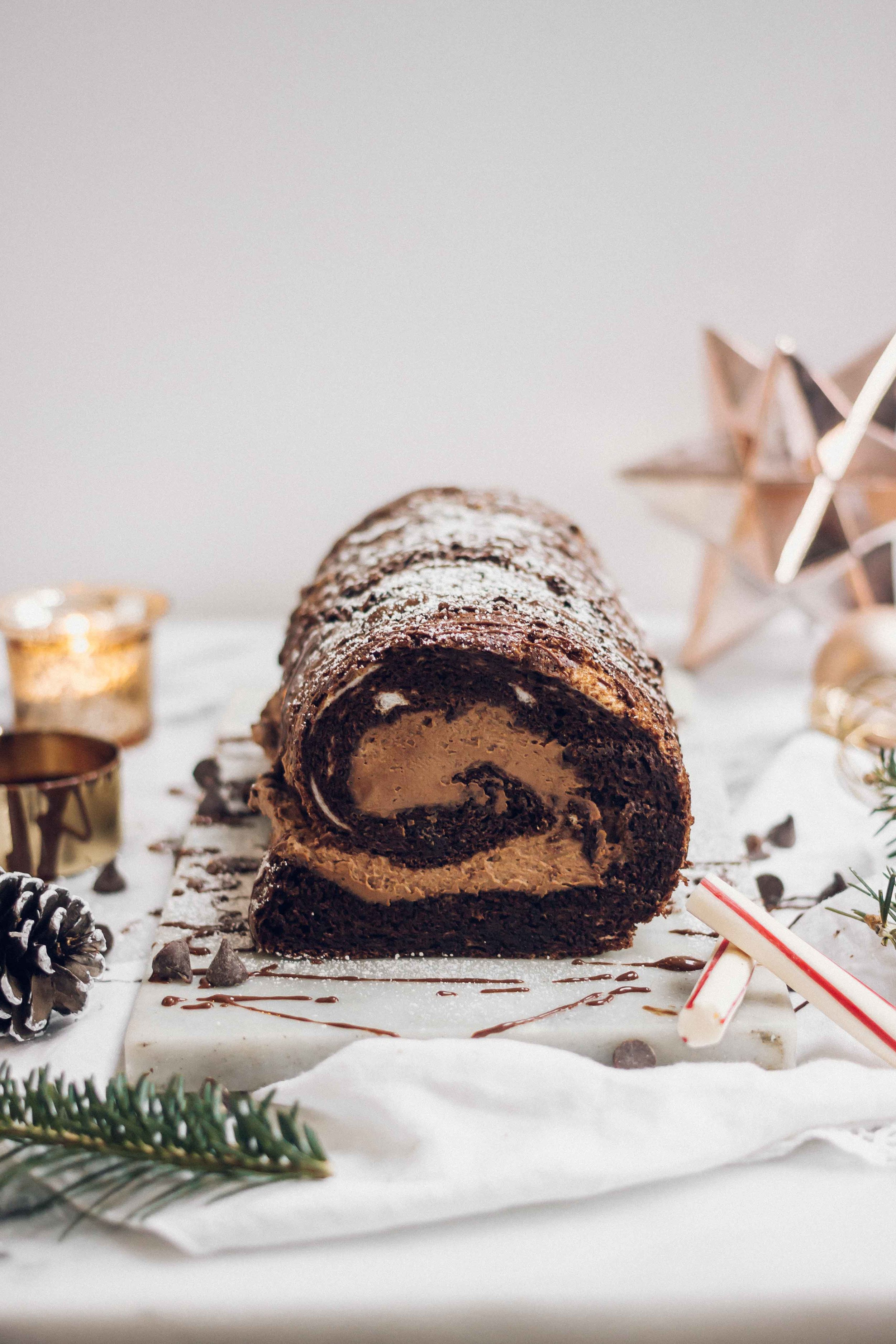 French Gluten Free Bûche De Nöel Christmas Recipe - The Well Essentials - A decadent and simple twist on a traditional french buche de noel, this cake is rich with chocolate flavor and whipped cream