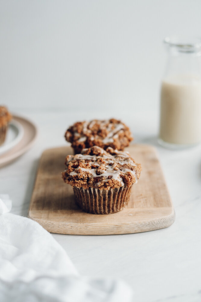 pumpkin streusel muffins on a white backdrop