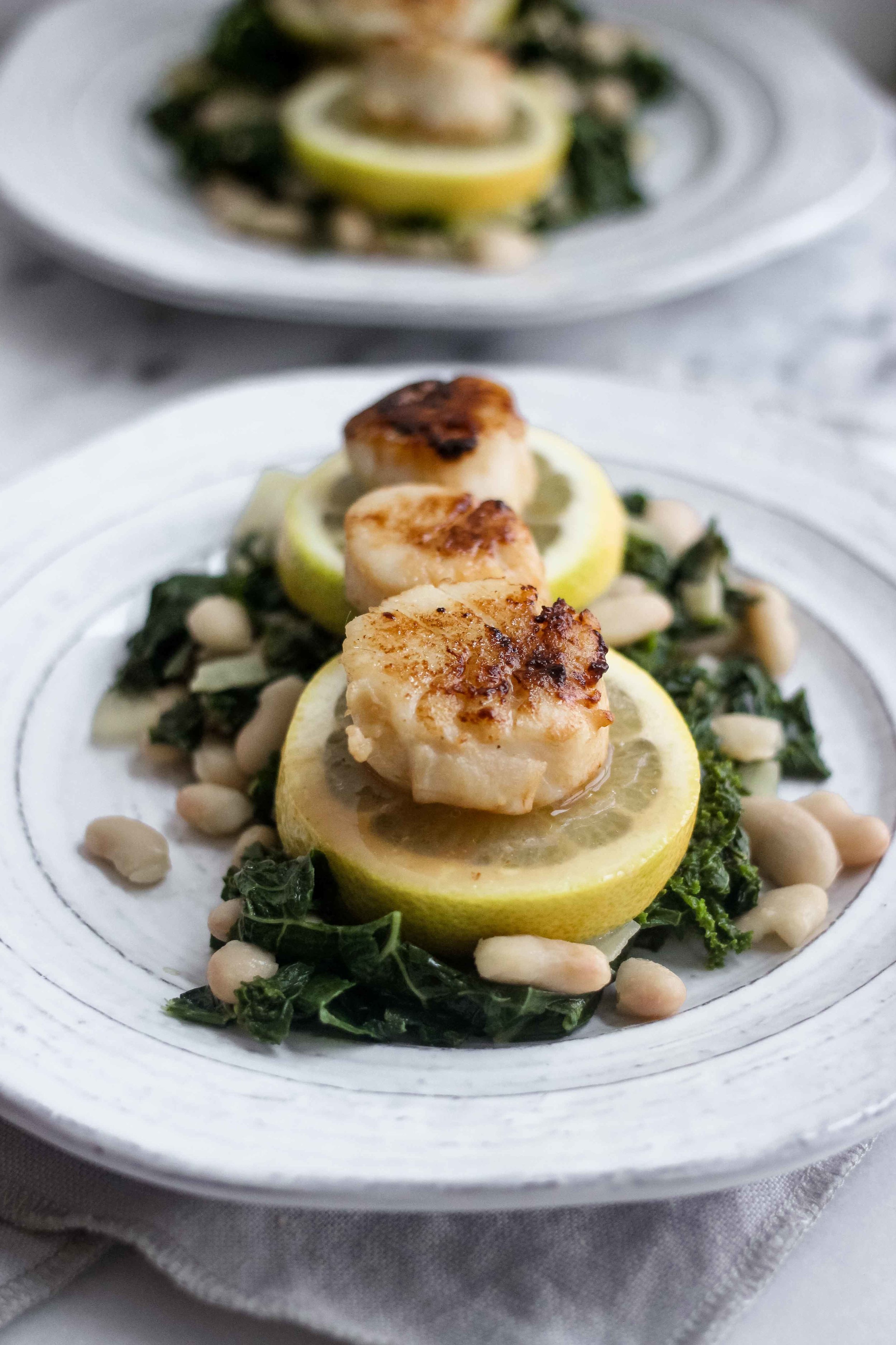 Seared Lemon Butter Scallops With Kale and White Beans - The Well Essentials
