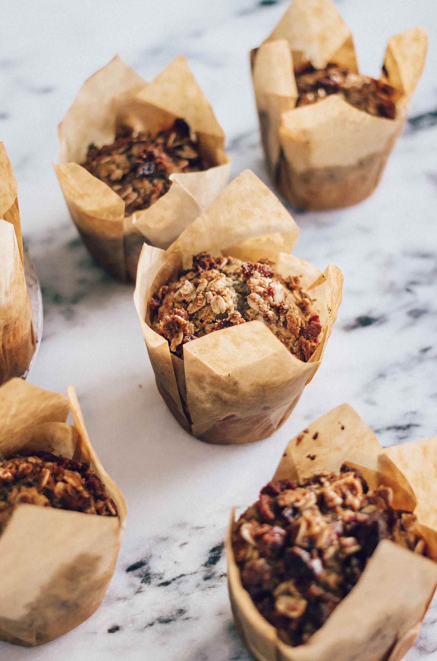 oatmeal cranberry muffins in a parchment paper wrapper